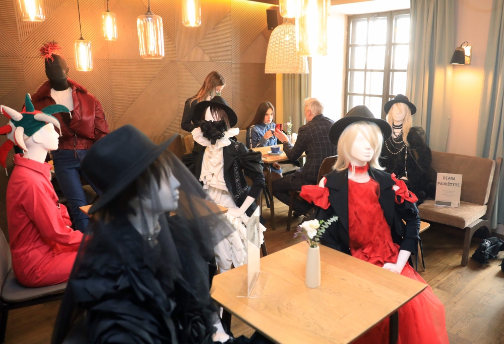 Mannequins are placed to provide social distancing at a restaurant in Vilnius, Lithuania on May 21, 2020 amid the novel coronavirus COVID-19 pandemic. AFP / PETRAS MALUKAS 