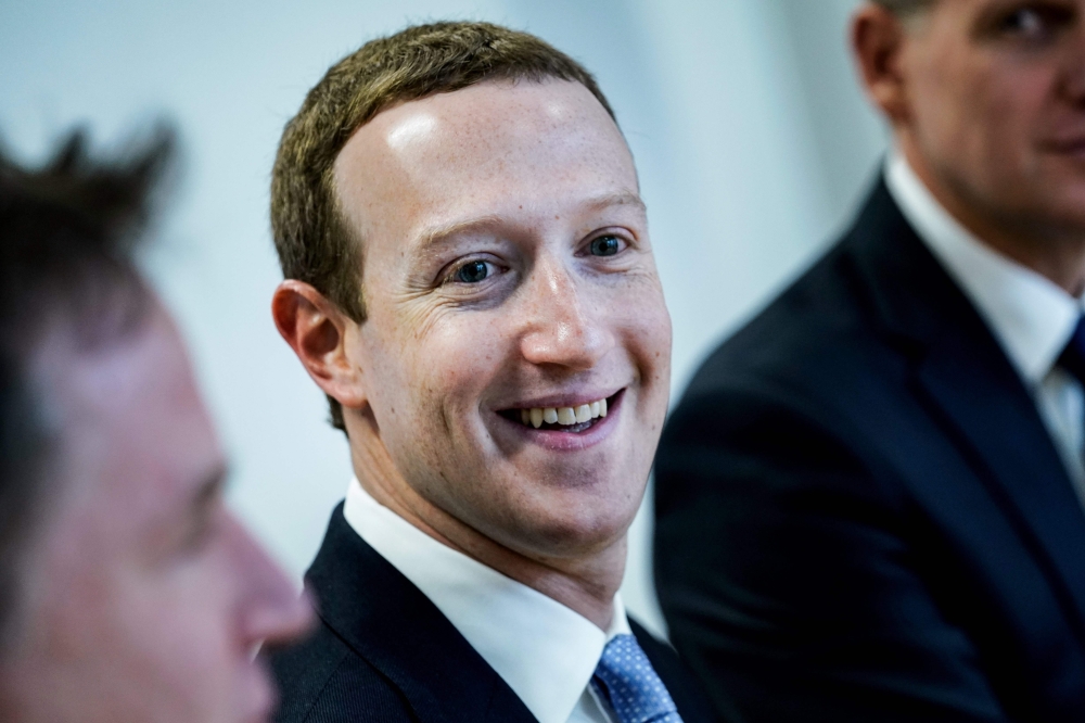 (FILES) In this file photo Founder and CEO of US online social media and social networking service Facebook Mark Zuckerberg reacts upon his arrival for a meeting with European Commission vice-president in charge for Values and Transparency, in Brussels, o