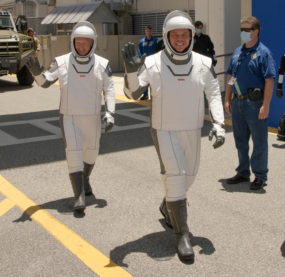 This handout photo released by NASA shows NASA astronauts Douglas Hurley, left, and Robert Behnken, wearing SpaceX spacesuits. (AFP / NASA / Bill INGALLS)
