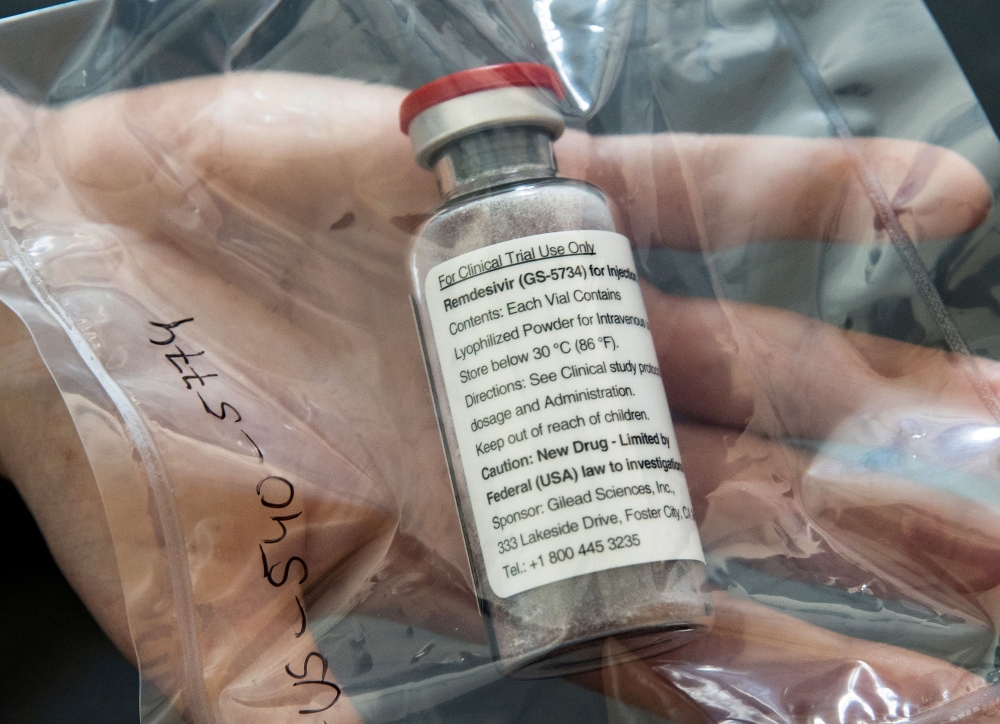 (FILES) In this file photo taken on April 08, 2020, vials of the drug remdesivir sit on a table during a press conference about the start of a study of the Ebola drug in severely ill COVID-19 patients, at the University Hospital Eppendorf in Hamburg, Germ