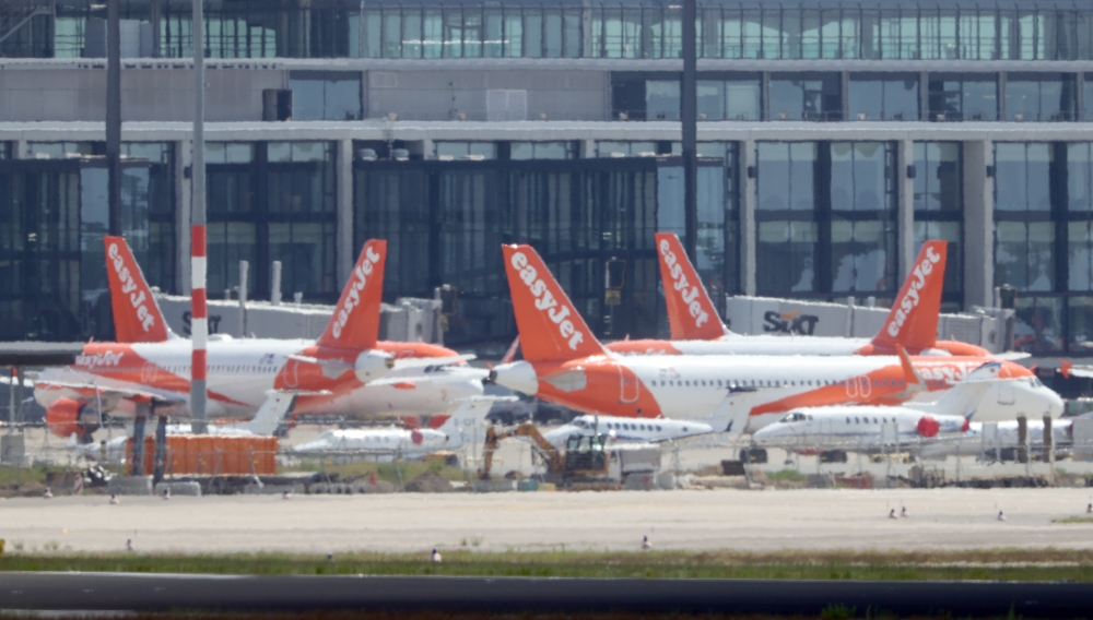 EasyJet planes are parked at the Berlin Schoenefeld airport, amid the spread of the coronavirus disease (COVID-19) in Schoenefeld, Germany, May 26, 2020. REUTERS/Fabrizio Bensch
