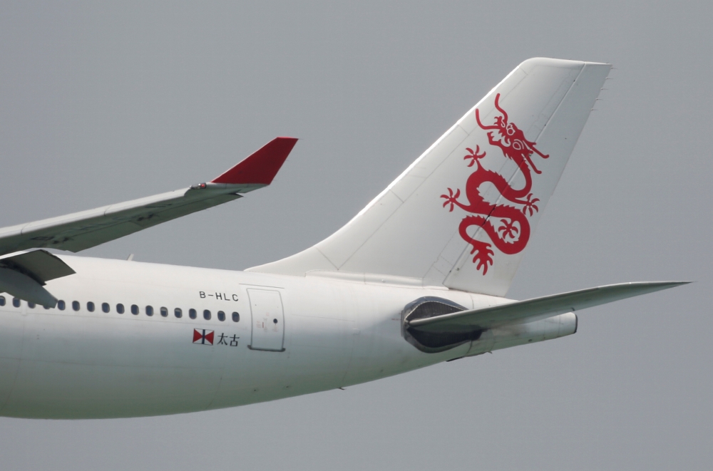 FILE PHOTO: A Cathay Dragon Airbus A330-300 plane descends before landing at Hong Kong Airport in Hong Kong, China April 4, 2018. REUTERS/Bobby Yip