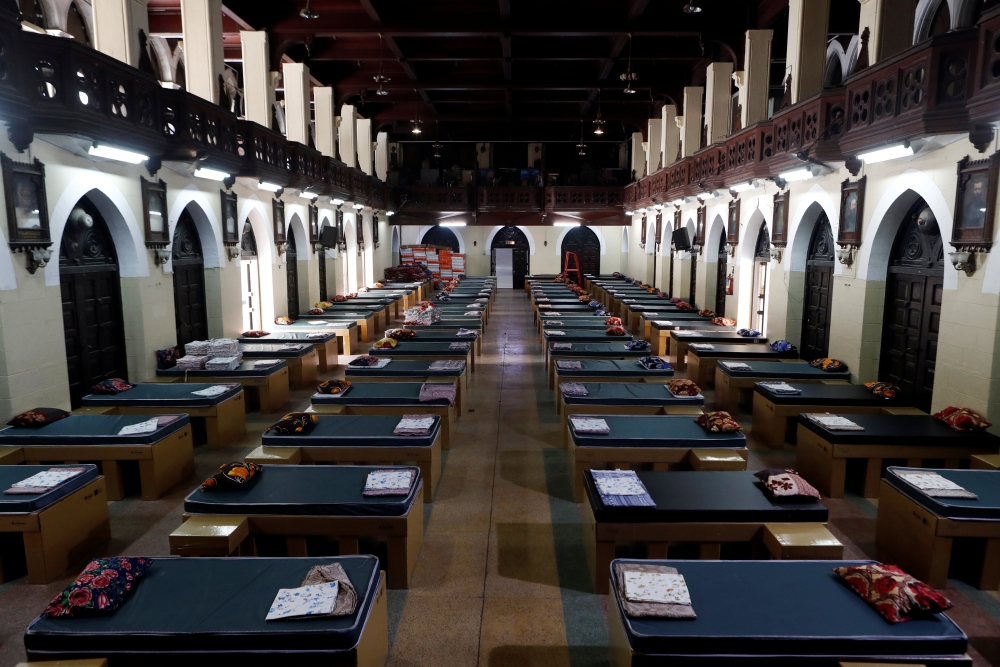 Disposable beds made out of cardboard are seen at a makeshift quarantine area that has been constructed to treat patients inside St Xavier's college, during an extended lockdown to slow the spread of the coronavirus disease (COVID-19), in Mumbai, India, M