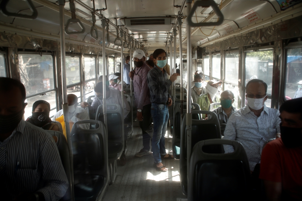 Commuters are seen inside a public transport bus after some restrictions were lifted during a nationwide lockdown to slow the spread of the coronavirus disease (COVID-19), in Mumbai, India, June 8, 2020. Reuters/Francis Mascarenhas