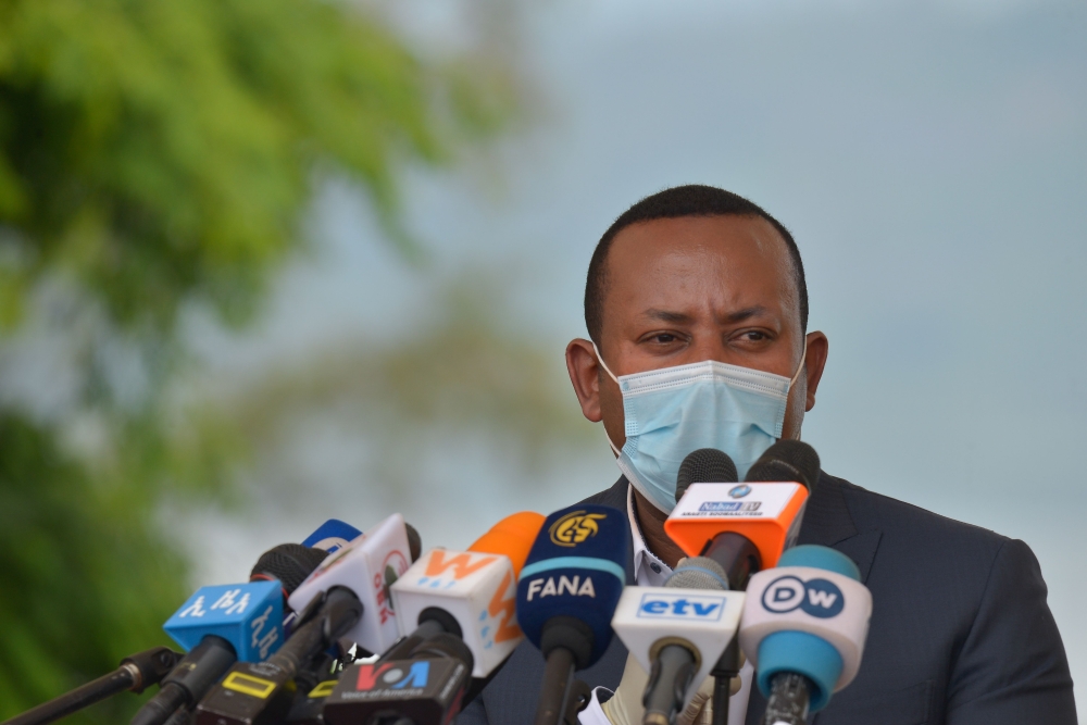 Ehiopia's Prime Minister Abiy speaks before planting a tree during the tree-planting ceremony of his initial project to plant five billion trees during this year's rainy season in Hawassa on June 5, 2020, ahead of World Environment Day. / AFP / Michael TE