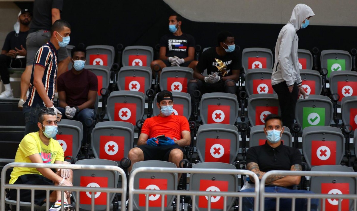  Players maintaining distance between themselves as they wait for their PCR tests yesterday.