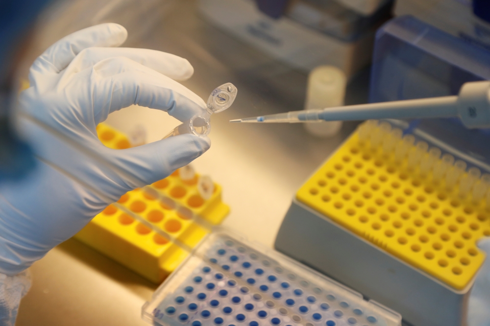 A scientist dilutes samples during the research and development of a vaccine against the coronavirus disease (COVID-19) at a laboratory of BIOCAD biotechnology company in Saint Petersburg, Russia June 11, 2020. REUTERS/Anton Vaganov
