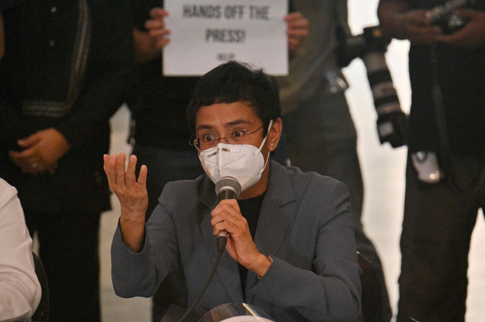 Philippine journalist Maria Ressa speaks during a press conference after attending the court's verdict promulgation in Manila on June 15, 2020. / AFP / Ted ALJIBE