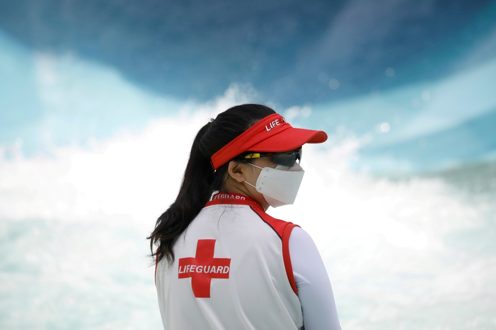 FILE PHOTO: A water park employee looks on in Yongin, South Korea, as measures to avoid the spread of the coronavirus disease (COVID-19) continue, June 5, 2020. REUTERS/Kim Hong-Ji/File Photo