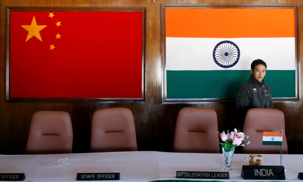 A man walks inside a conference room used for meetings between military commanders of China and India, at the Indian side of the Indo-China border at Bumla, in the northeastern Indian state of Arunachal Pradesh, November 11, 2009. REUTERS/Adnan Abidi/File