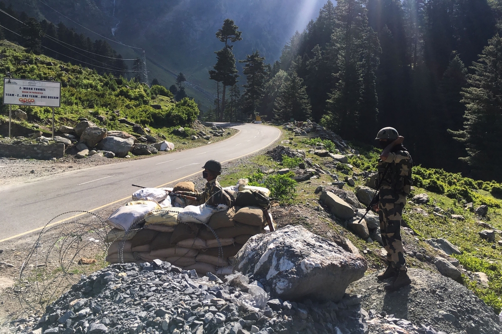 :TOPSHOT - Indian Border Security Force (BSF) soldiers guard a highway leading towards Leh, bordering China, in Gagangir on June 17, 2020. The long-running border dispute between Asian nuclear powers India and China turned deadly for the first time in nea