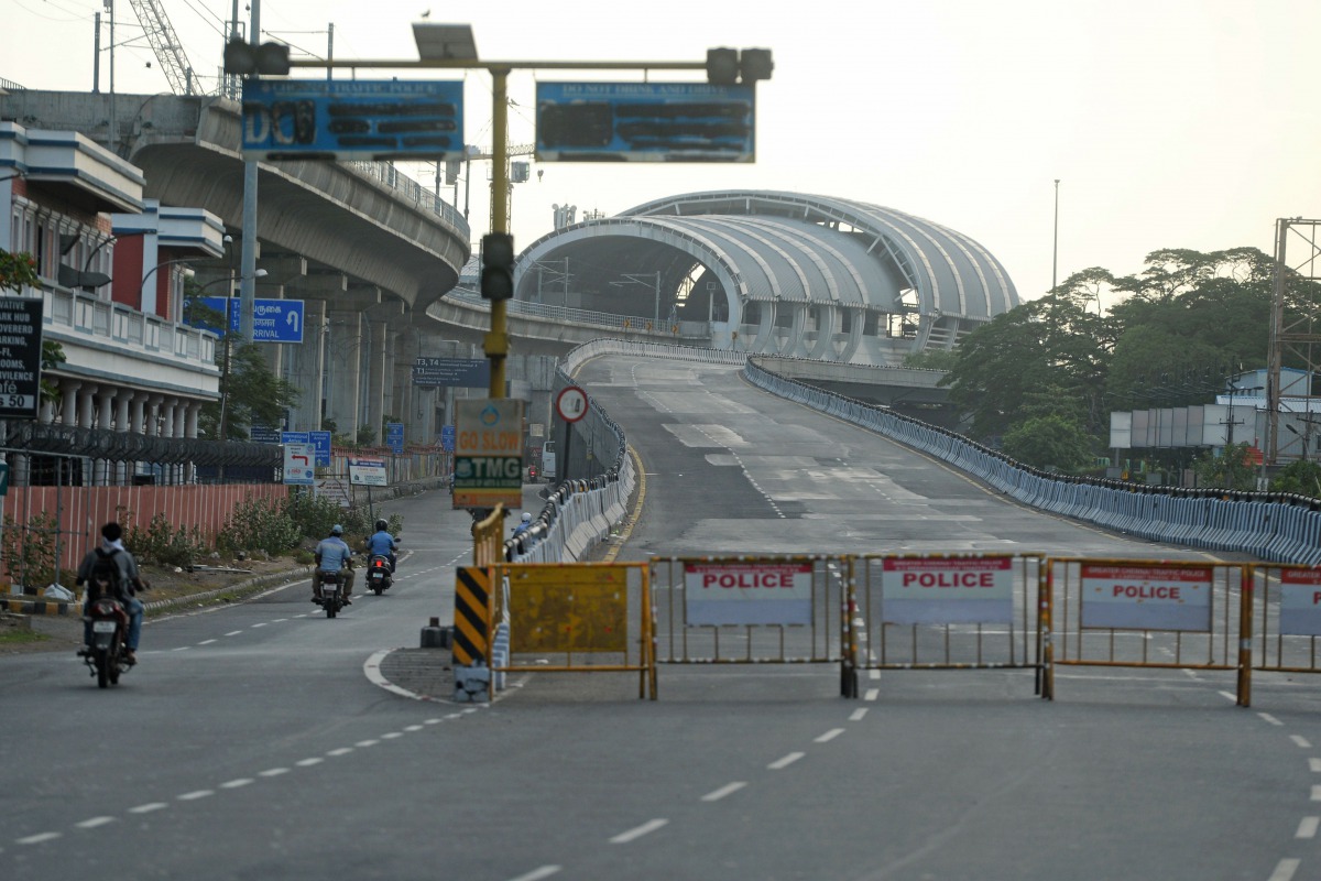 Motorists ride past a deserted road after a lockdown was reimposed as a preventive measure against the spread of the COVID-19 coronavirus, in Chennai on June 19, 2020./ AFP / Arun SANKAR
