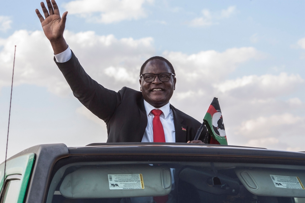 (FILES) In this file photo taken on June 20, 2020, Malawi’s main opposition Malawi Congress Party, MCP, Leader Lazarus Chakwera who is leading the Tonse Alliance in the Presidential elections due on June 23, arrives at Mtandire locations in the suburb of 