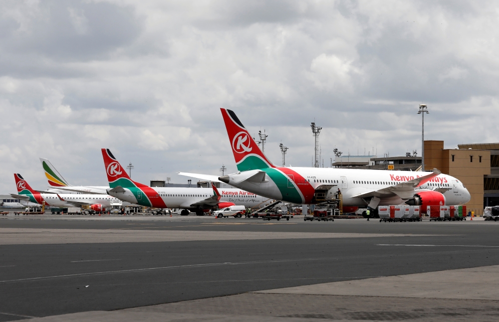 Kenyan Airways planes are parked at the Jomo Kenyatta International Airport in Nairobi, Kenya, March 24, 2020. REUTERS/Baz Ratner/File Photo