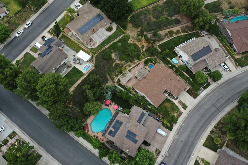 Solar panels are seen on rooftops amid the coronavirus disease (COVID-19) outbreak, in Santa Clarita, near Los Angeles, California, U.S., June 18, 2020. Picture taken June 18, 2020. REUTERS/Lucy Nicholson