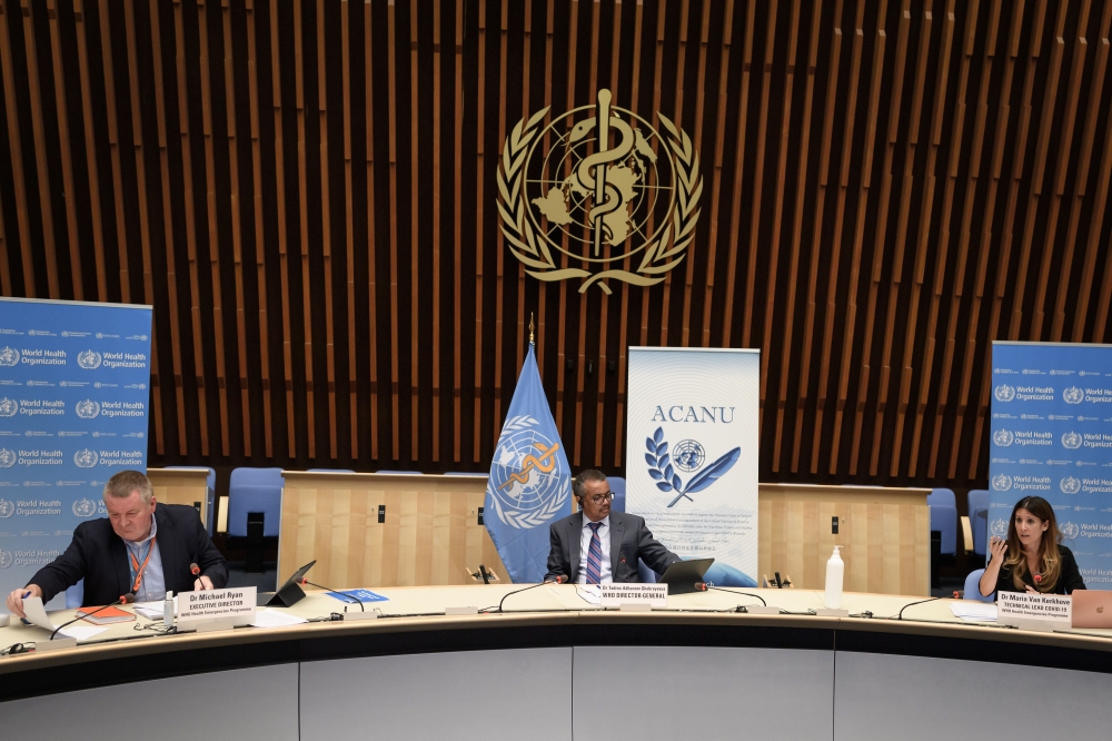 (From L to R) World Health Organization (WHO) Health Emergencies Programme head Michael Ryan, WHO Director-General Tedros Adhanom Ghebreyesus and WHO Technical lead head Covid-19 Maria Van Kerkhove attend a press conference organized by Geneva Association