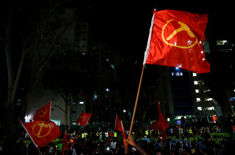 Workers’ Party supporters celebrate the results of the general election in Singapore July 11, 2020. (REUTERS/Edgar Su)