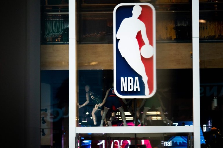 NBA logo is shown at the 5th Avenue NBA store in New York City. AFP / Jeenah Moon