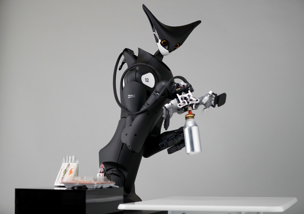 Telexistence's shelf-stacking avatar robot, designed to resemble a kangaroo and developed to work in a convenience store, is demonstrated during a photo opportunity ahead of its unveiling in Tokyo, Japan July 3, 2020. Picture taken July 3, 2020. REUTERS/I