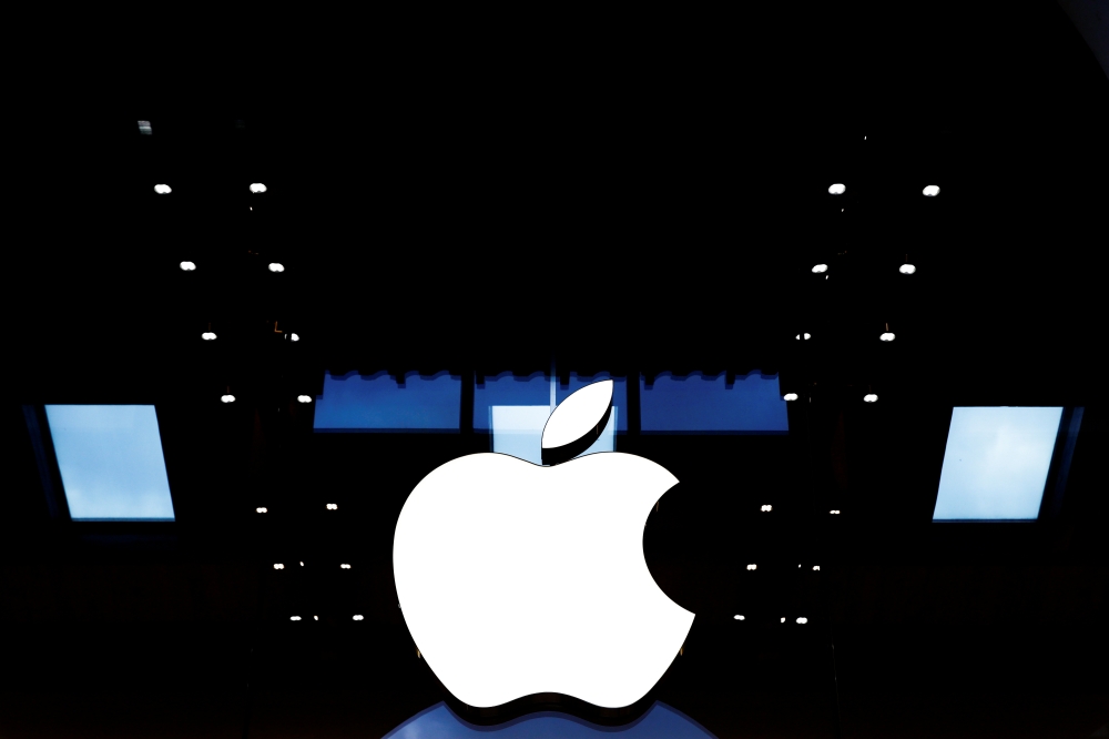 Apple logo is seen on the Apple store at The Marche Saint Germain in Paris, France July 15, 2020. REUTERS/Gonzalo Fuentes