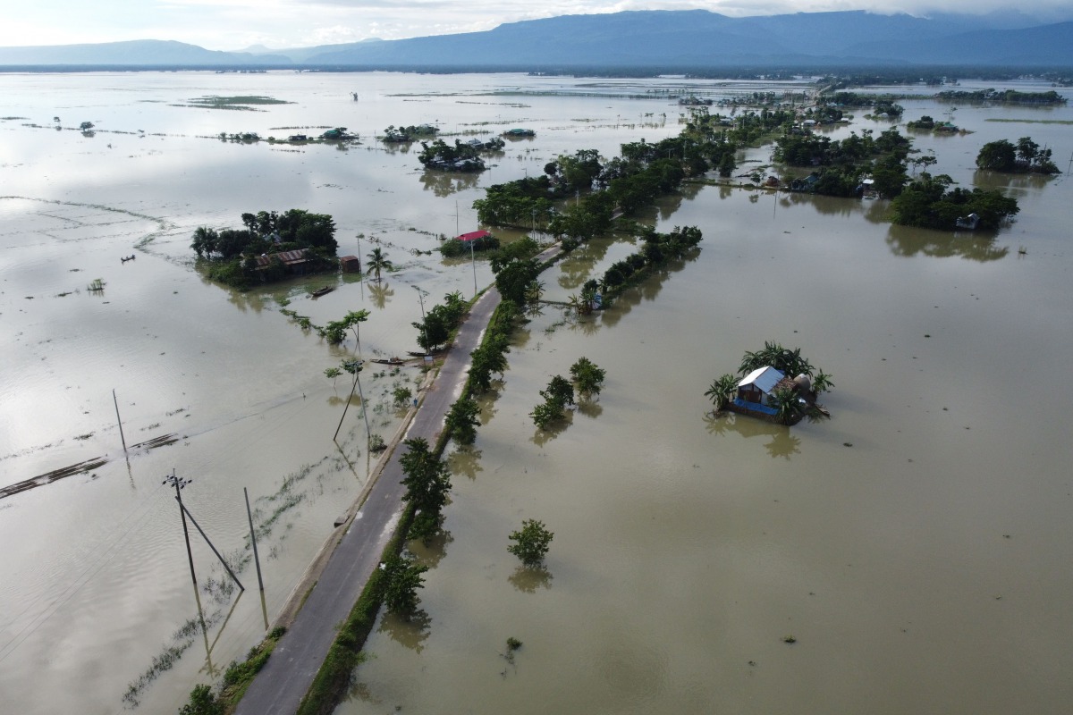 TOPSHOT - In this aerial photo inundated houses are seen in Sunamgong on July 14, 2020. Almost four million people have been hit by monsoon floods in South Asia, officials said July 14, with a third of Bangladesh already underwater from some of the heavie