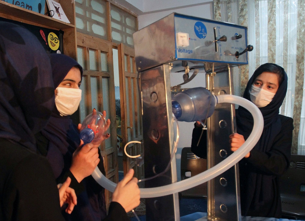 Members of an Afghan all-female robotics team work on an open-source and low-cost ventilator, during the coronavirus disease (COVID-19) outbreak in Herat Province, Afghanistan April 15, 2020. Picture taken April 15, 2020.REUTERS/Jalil Ahmad