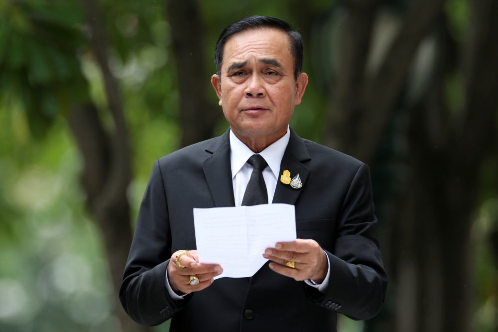 FILE PHOTO: Thailand's Prime Minister Prayuth Chan-ocha speaks to media members at the Government House in Bangkok, Thailand June 6, 2019. REUTERS/Athit Perawongmetha/File Photo