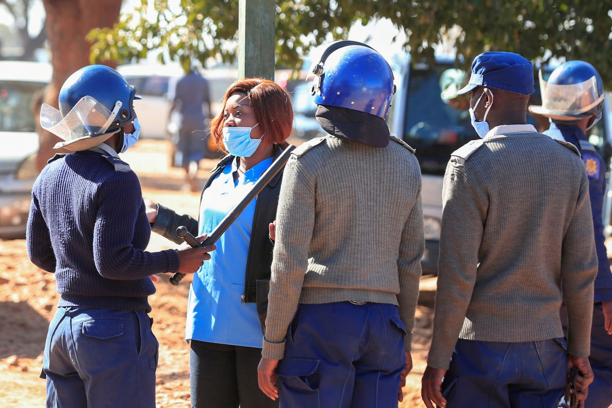 FILE PHOTO: Police arrest a health worker during a protest against economic hardship and poor working conditions during the coronavirus disease (COVID-19) outbreak in Harare, Zimbabwe,July 6, 2020. REUTERS/Philimon Bulawayo/File Photo
