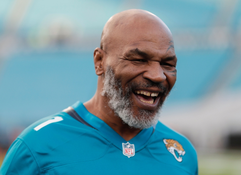 In this file photo taken on September 19, 2019, former world heavyweight champion Mike Tyson before the start of the Tennessee Titans at Jacksonville Jaguars in Jacksonville, Florida. Tyson, who retired in 2005, said on July 23, 2020, he will make a comeb