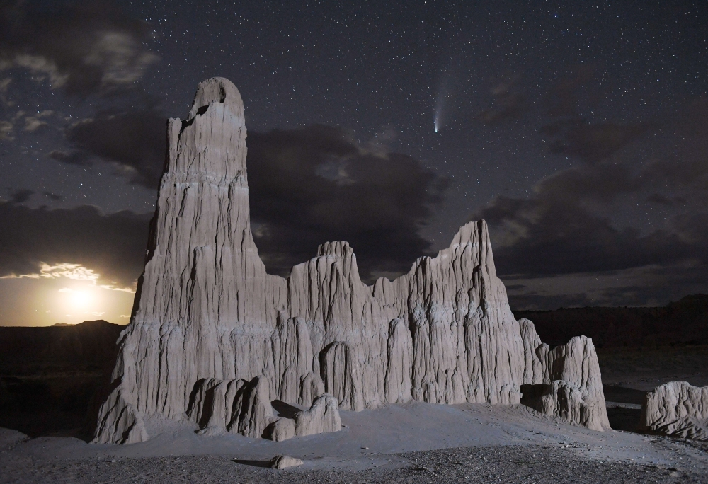 The Comet NEOWISE (C/2020 F3) is seen above a bentonite clay spire in the Panaca Formation on July 23, 2020 in Cathedral Gorge State Park, Nevada. The comet is named after NASA's Near-Earth Object Wide-field Infrared Survey Explorer, which discovered it i
