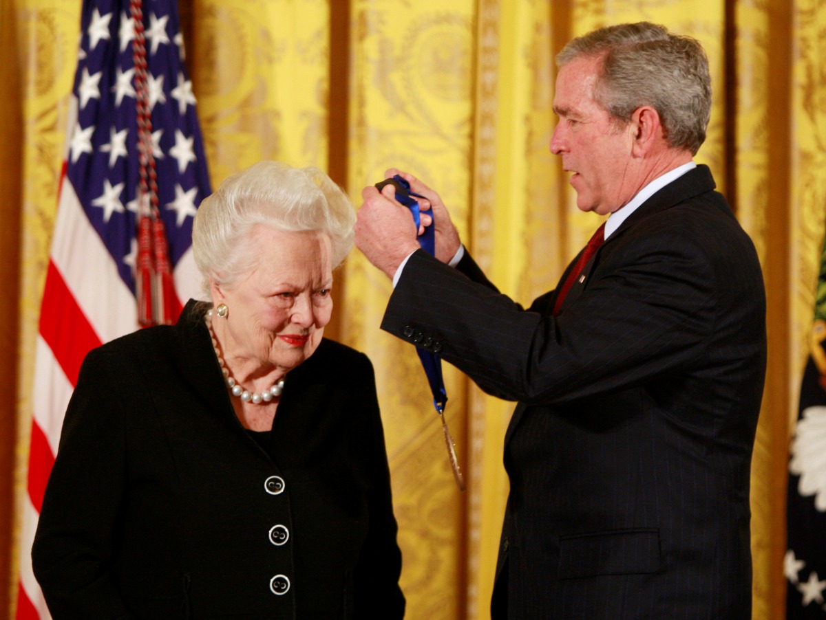 FILE PHOTO: U.S. President George W. Bush presents veteran actress Olivia de Havilland with a National Medal of Arts during a ceremony at the White House in Washington in Washington, U.S. November 17, 2008. REUTERS/Jason Reed/File Photo
