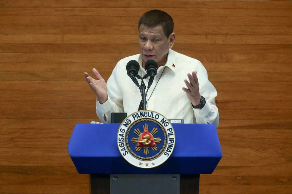 This handout photo taken and released on July 27, 2020 by the Philippines' Presidential Photo Division (PPD) shows Philippine President Rodrigo Duterte delivering his annual State of the Nation Address in congress in Manila. AFP PHOTO / PRESIDENTIAL PHOTO