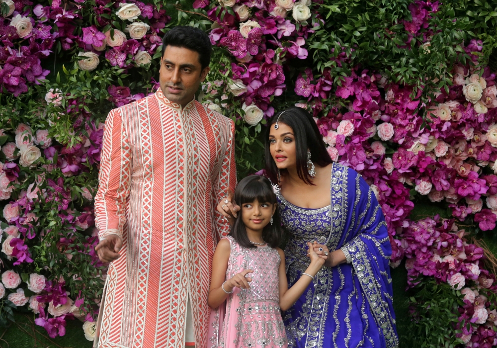 FILE PHOTO: Actor Abhishek Bachchan, his wife actress Aishwarya Rai and their daughter Aaradhya pose during a photo opportunity at the wedding ceremony of Akash Ambani, son of the Chairman of Reliance Industries Mukesh Ambani, at Bandra-Kurla Complex in M