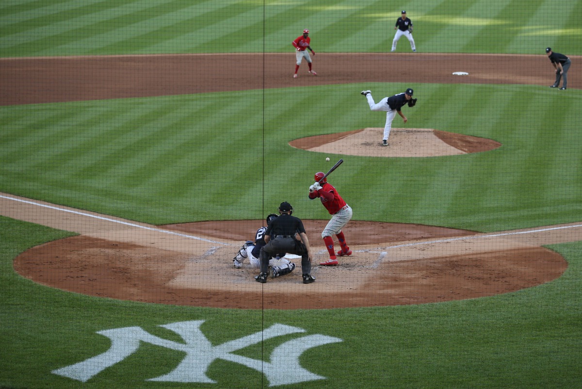 Jul 20, 2020; Bronx, New York, USA; New York Yankees relief pitcher David Hale (75) pitches to Philadelphia Phillies shortstop Didi Gregorius (18) during the second inning of a preseason game at Yankee Stadium. Mandatory Credit: Brad Penner-USA TODAY Spor