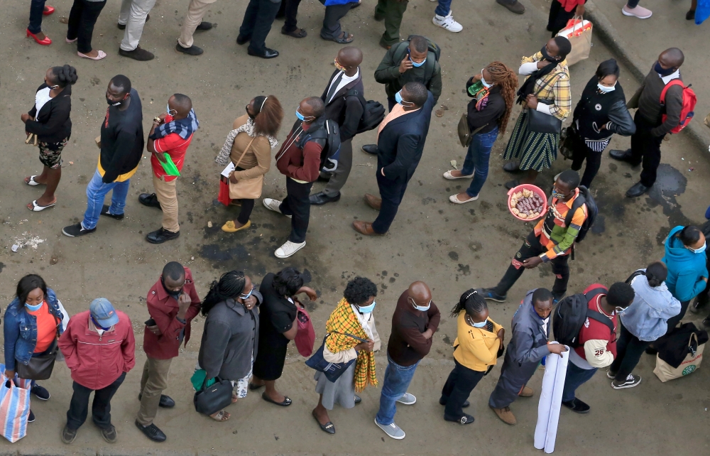 Residents queue for public transport before the curfew to curb the spread of the coronavirus disease (COVID-19), in downtown Nairobi, Kenya July 27, 2020. REUTERS/Thomas Mukoya