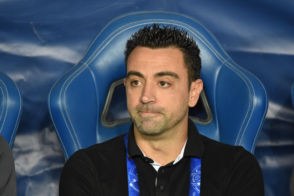  A file photo taken on October 22, 2019 shows Al Sadd's Spanish coach Xavi Hernandez watching the second leg of the AFC Champions League semi-finals football match between Qatar's Al Sadd and Saudi' Al Hilal in Riyadh. Barcelona legend Xavi tested positiv