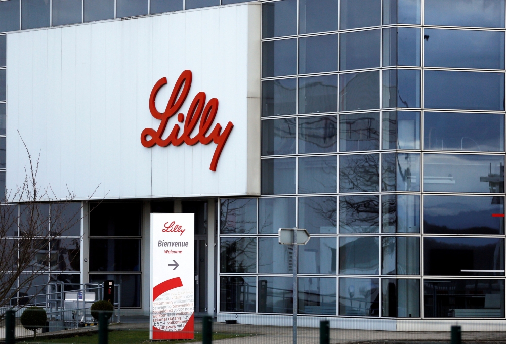 FILE PHOTO: The logo of Lilly is seen on a wall of the Lilly France company unit, part of the Eli Lilly and Co drugmaker group, in Fegersheim near Strasbourg, France, February 1, 2018. REUTERS/Vincent Kessler/File Photo