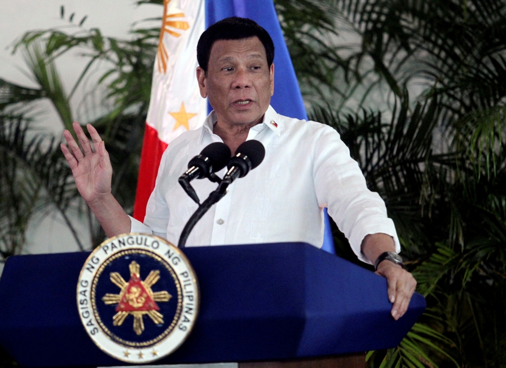 FILE PHOTO: FILE PHOTO: President Rodrigo Duterte speaks after his arrival, from a visit in Israel and Jordan at Davao International airport in Davao City in southern Philippines, September 8, 2018. REUTERS/Lean Daval Jr/File Photo