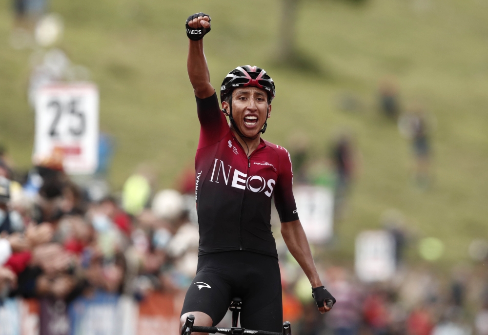 Colombia's Egan Bernal of Team Ineos celebrates winning the 3rd stage of 163,5km between Saint-Gaudens and Col-de-Breyere in Le Garric, France, of the La Route d'Occitanie cycling race, on August 3, 2020. / AFP / POOL / Guillaume HORCAJUELO