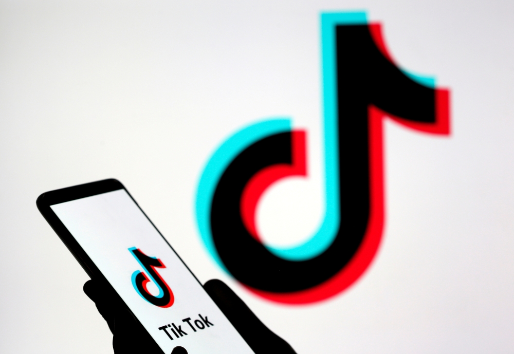 FILE PHOTO: A person holds a smartphone with the TikTok logo displayed in this picture illustration taken Nov. 7, 2019. REUTERS/Dado Ruvic/Illustration/File Photo