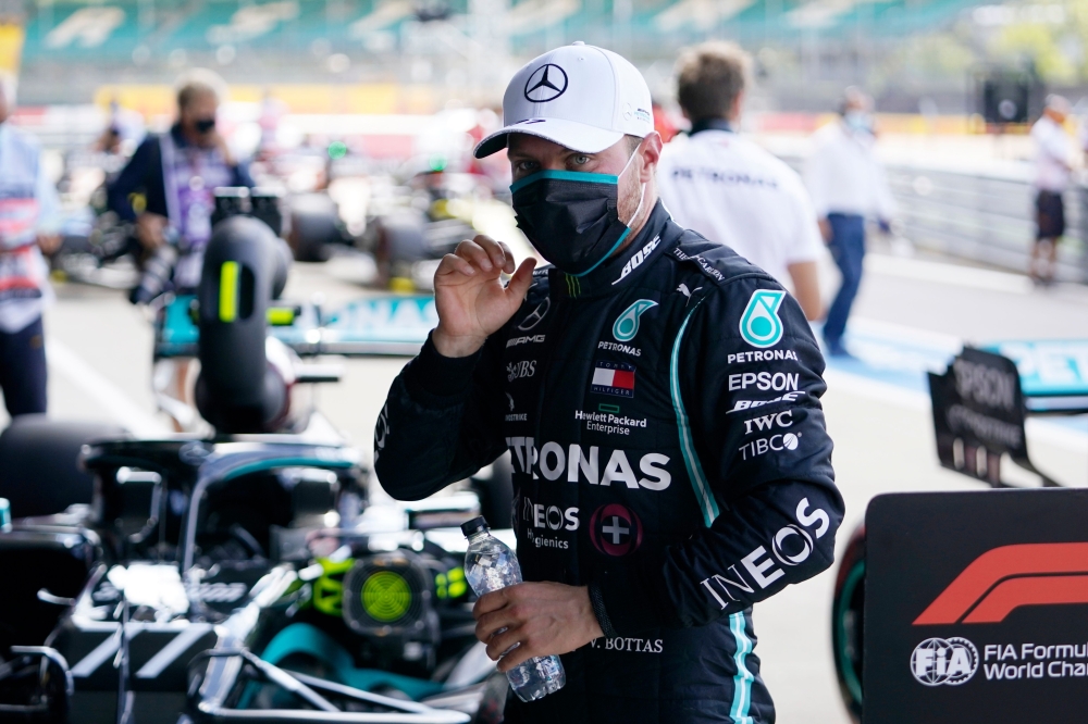 Mercedes' Finnish driver Valtteri Bottas reacts after finishing second in the qualifying session for the Formula One British Grand Prix at the Silverstone motor racing circuit in Silverstone, central England on August 1, 2020. / AFP / POOL / Will Oliver