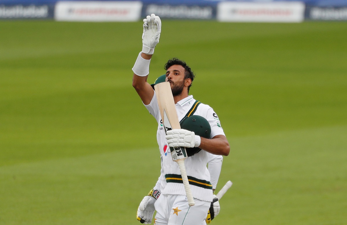 Cricket - First Test - England v Pakistan - Emirates Old Trafford, Manchester, Britain - August 6, 2020 Pakistan's Shan Masood celebrates his century, as play resumes behind closed doors following the outbreak of the coronavirus disease (COVID-19) REUTERS