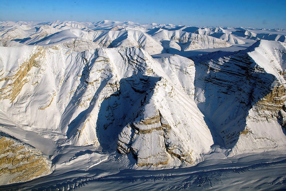 FILE PHOTO: Glaciers on Canada's Ellesmere Island are seen during a NASA Operation IceBridge survey flight April 1, 2014. Picture taken April 1, 2014. REUTERS/Michael Studinger/NASA/Handout/File Photo