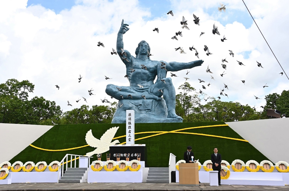 Doves fly during a ceremony marking the 75th anniversary of the atomic bombing of Nagasaki, at the Nagasaki Peace Park on August 9, 2020.  AFP 