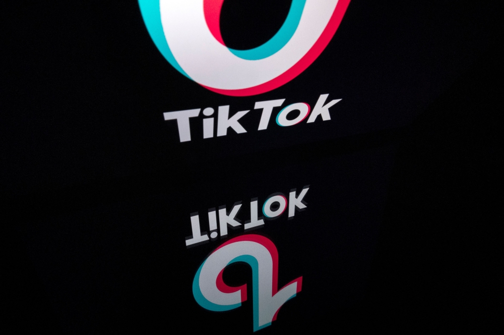This file photo taken on November 21, 2019 shows the logo of the social media video sharing app Tiktok displayed on a tablet screen in Paris./ AFP / Lionel BONAVENTURE