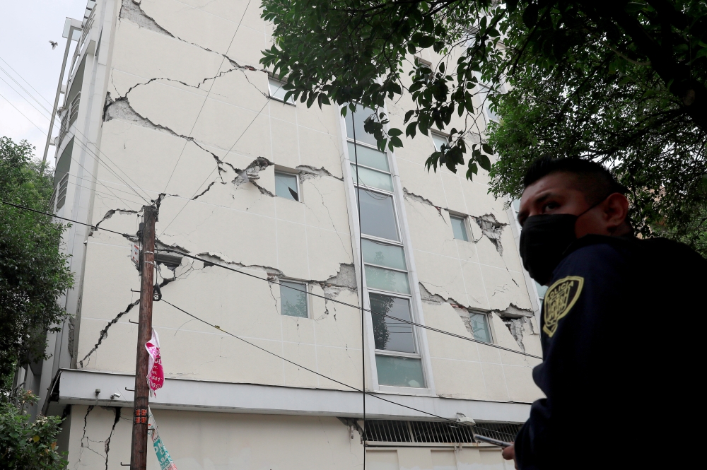 FILE PHOTO: A damaged building is seen after an earthquake in Mexico City, Mexico June 23, 2020. The building had already been damaged in a 2017 earthquake. REUTERS/ Carlos Jasso