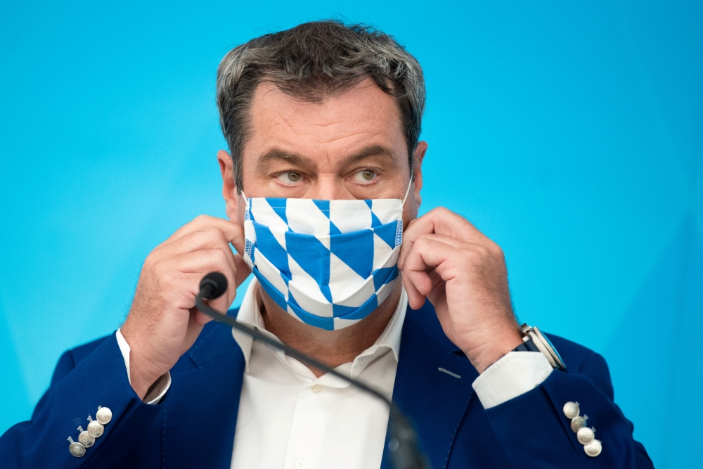 Bavarian State Prime Minister Markus Soeder leaves a news conference in Nuremberg, Germany, August 10, 2020. Nicolas Armer/Pool via Reuters/File Photo