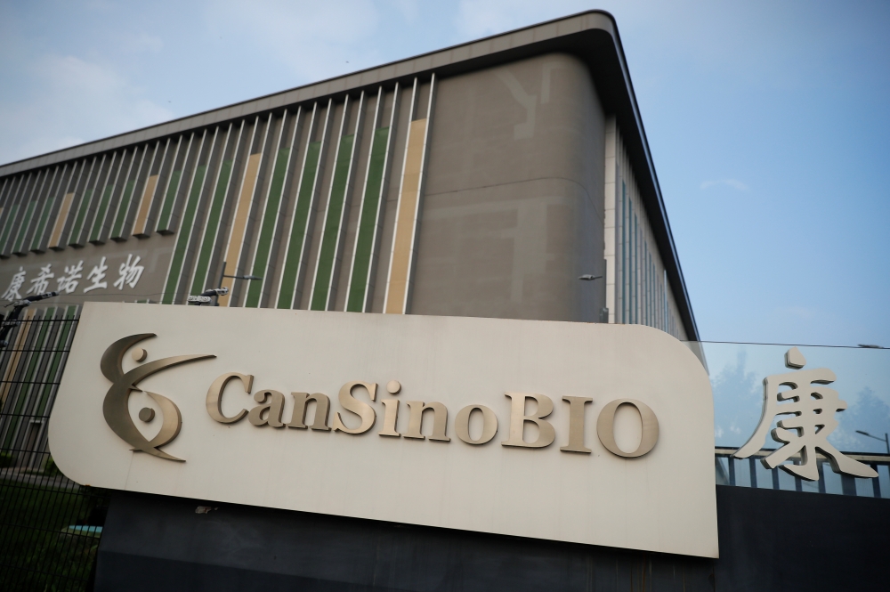A logo of China's vaccine specialist CanSino Biologics Inc is pictured on the company's headquarters in Tianjin, following an outbreak of the coronavirus disease (COVID-19), China August 17, 2020. REUTERS/Thomas Peter