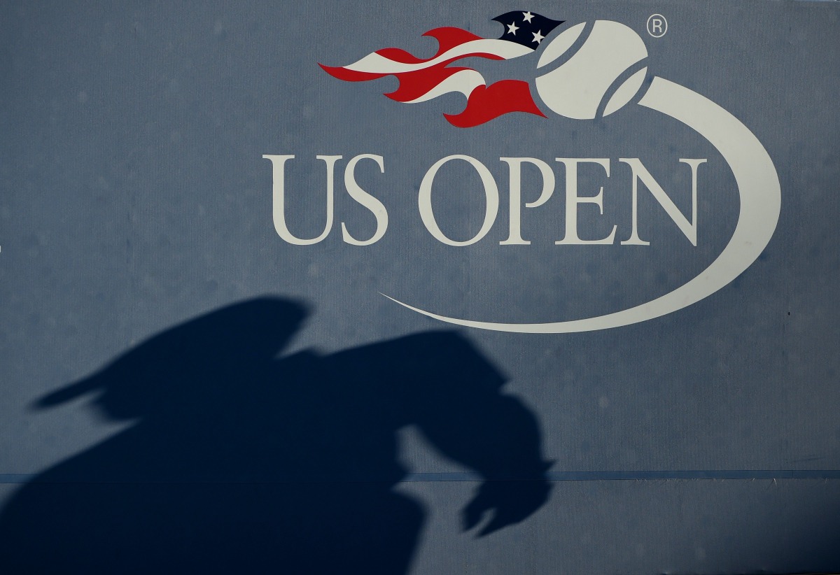 (FILES) In this file photo the shadow of an umpire is seen on the wall as Daniel Evans of the United Kingdom plays against Stan Wawrinka of Switzerland in their 2016 Us open men's single match at the USTA Billie Jean King National Tennis Center in New Yor
