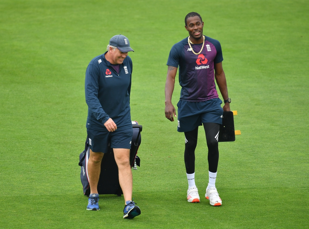August 14, 2020 England head coach Chris Silverwood with Jofra Archer before the start of play, as play resumes behind closed doors following the outbreak of the coronavirus disease (COVID-19) Glyn Kirk/Pool via REUTERS